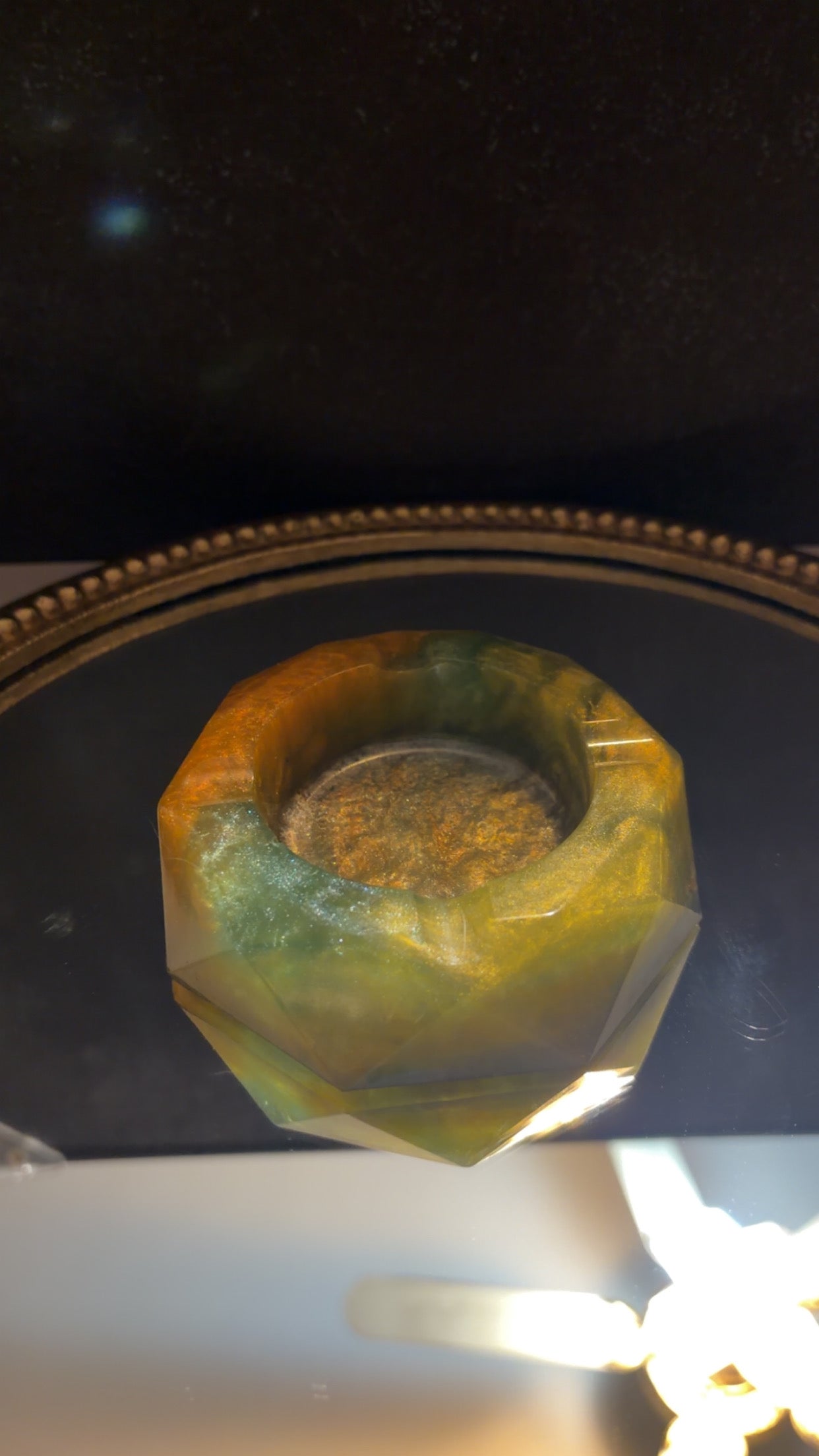 green and orange ashtray