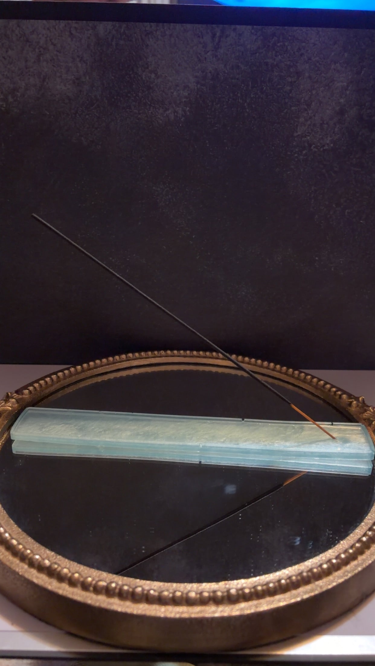 blue and orange incense burner