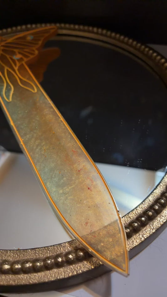 green and orange sword