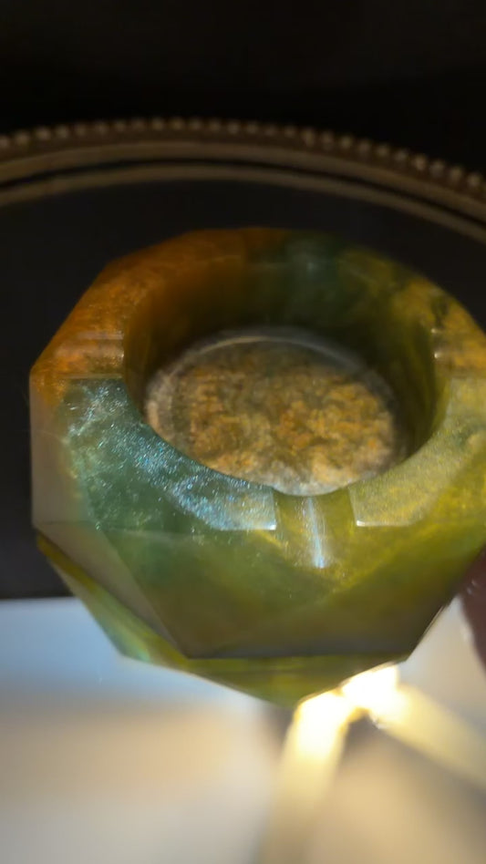 green and orange ashtray